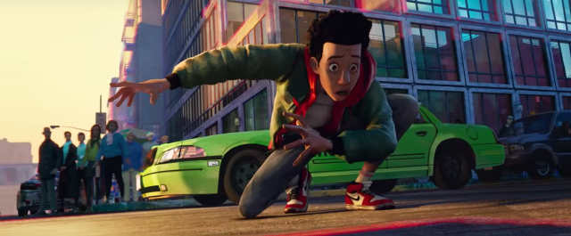 Screenshot from Into the Spiderverse; Miles Morales lands in an action pose in front of a green taxicab